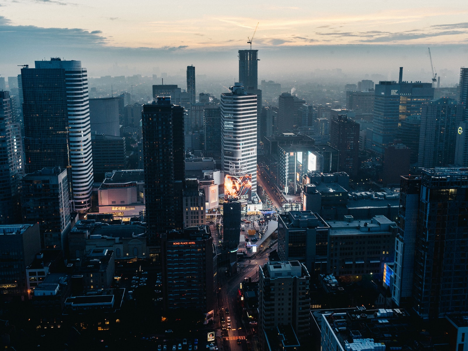 a view of a city at night from the top of a tall building