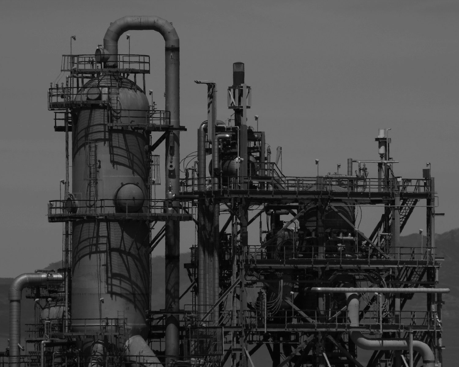 a black and white photo of an industrial plant